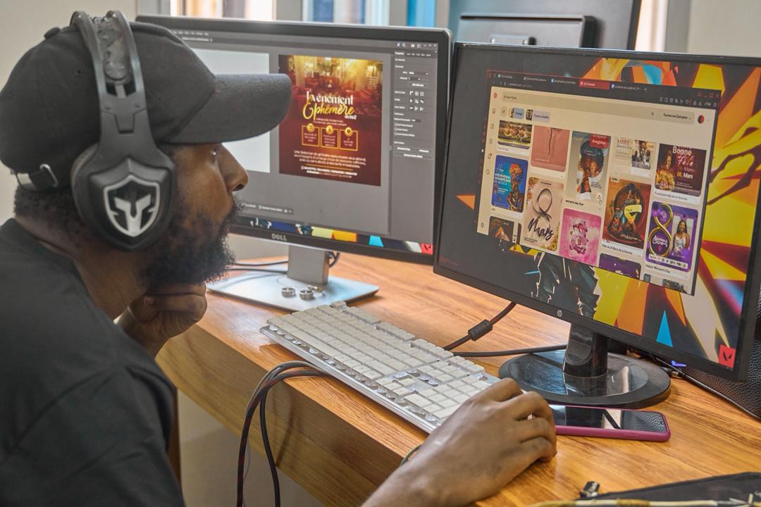 A New Vision Creatives designer working on brand identity in Photoshop